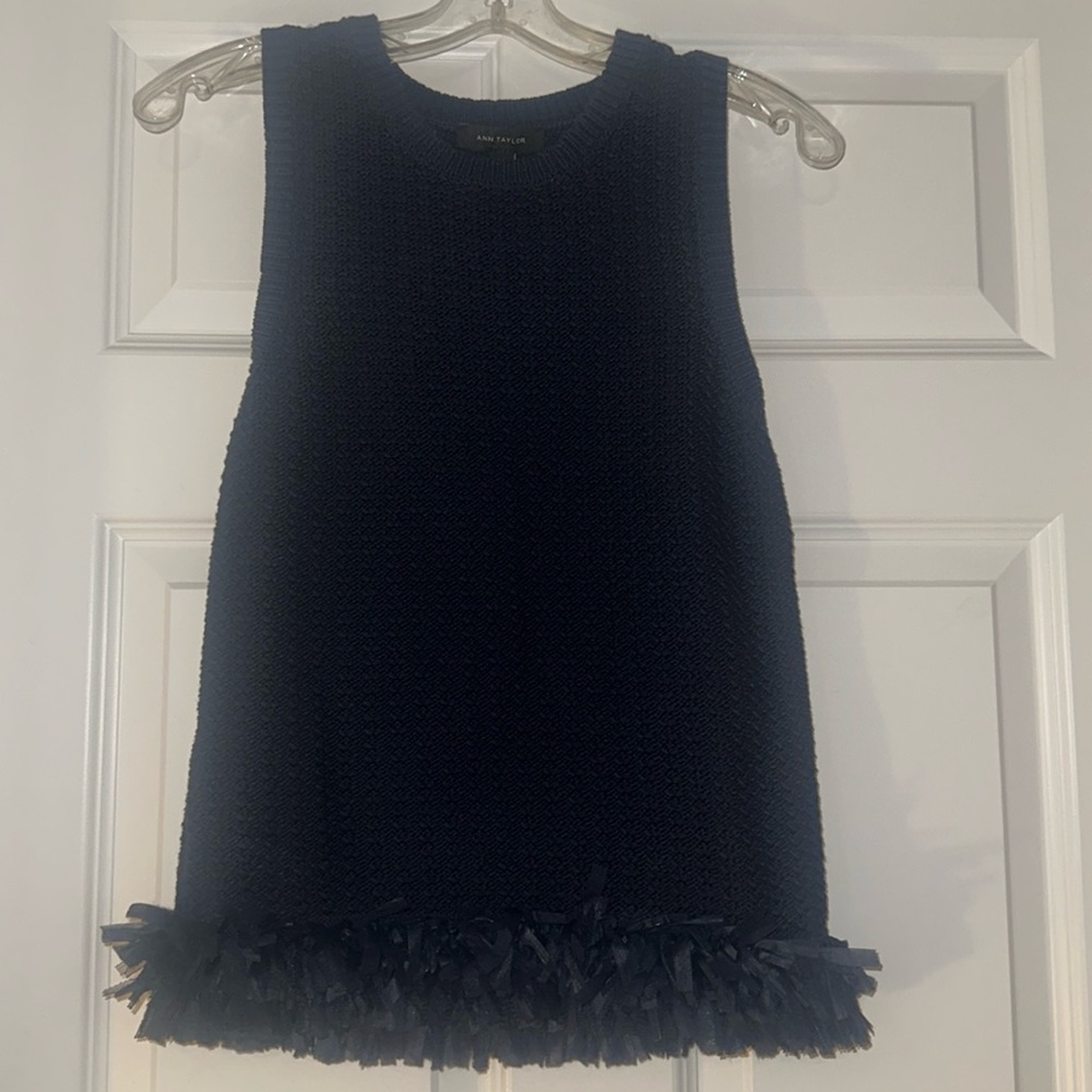 Ann Taylor, sleeveless knit top, with ruffle detail on the bottom